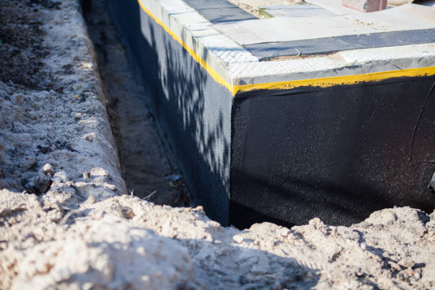 Professional Basement Waterproofing technician working in Willow Springs, IL